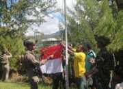 Ksatria Buaya Putih Kibarkan Bendera Merah Putih Bersama Masyarakat di Puncak Papua